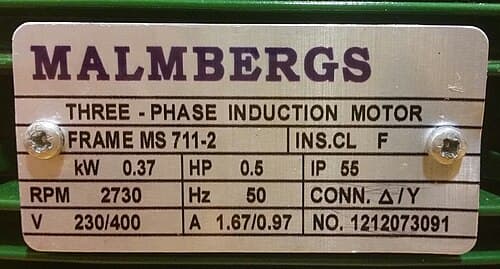 Motor nameplate photographed on the shop floor